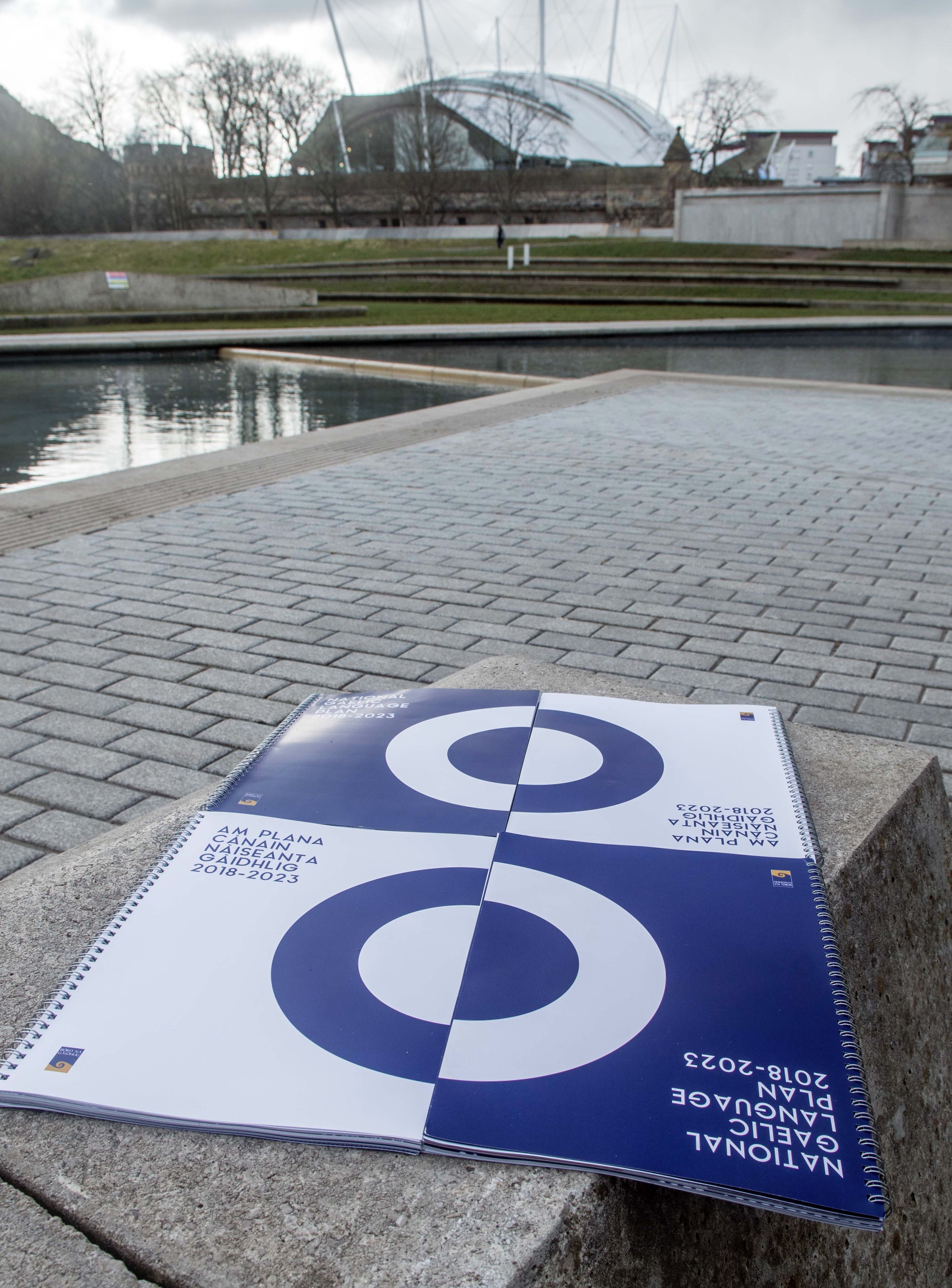 Picture: A copy of the National Gaelic Language Plan 2018-2023 on a bollard outside the Scottish Parliament