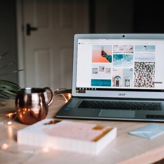 Picture: A laptop, and notebook on a home-working desk