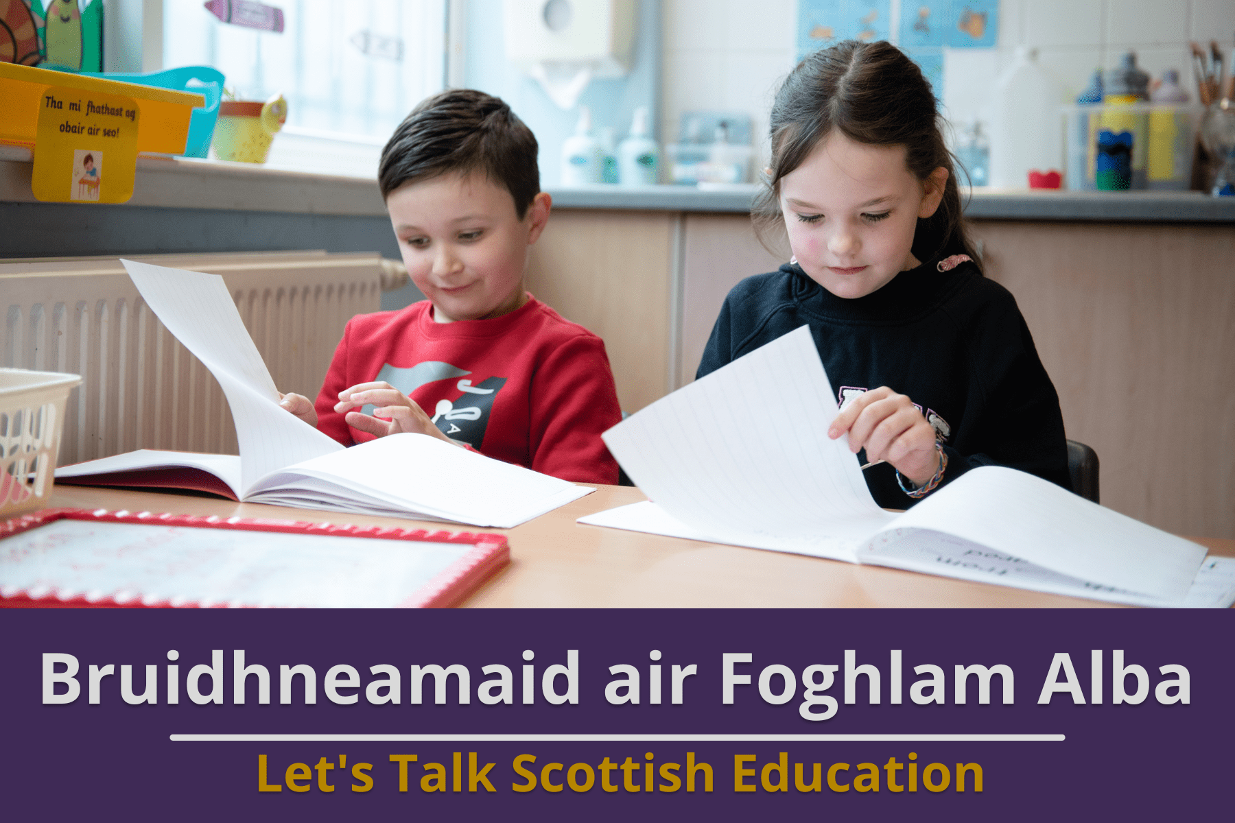 Picture: A boy and girl in a primary school classrom working at their desk. Text reads 'Let's Talk Scottish Education'