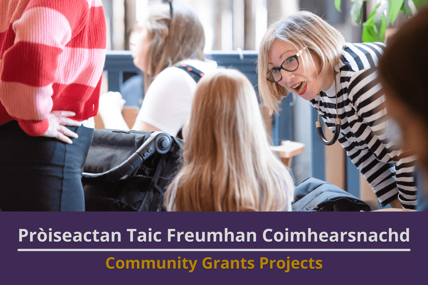 Picture: A woman bending down to speak to a young girl in a busy cafe. Text reads 'Community Grants Projects'