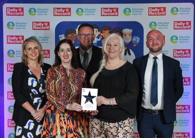 Picture: James Gillespie's High School Staff, winners of the Gaelic Award at the Scottish Education Awards, standing with Jennifer McHarrie, Bòrd na Gàidhlig's Director of Education, holding their award after collecting it at the awards ceremony. Text reads 'Education Newsletter June 2023'